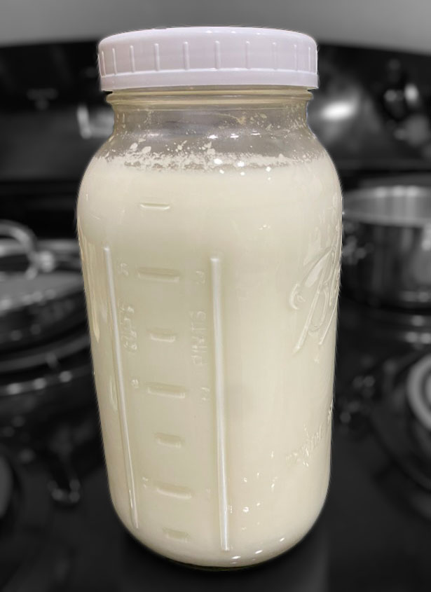 Quart glass mason jar with milk